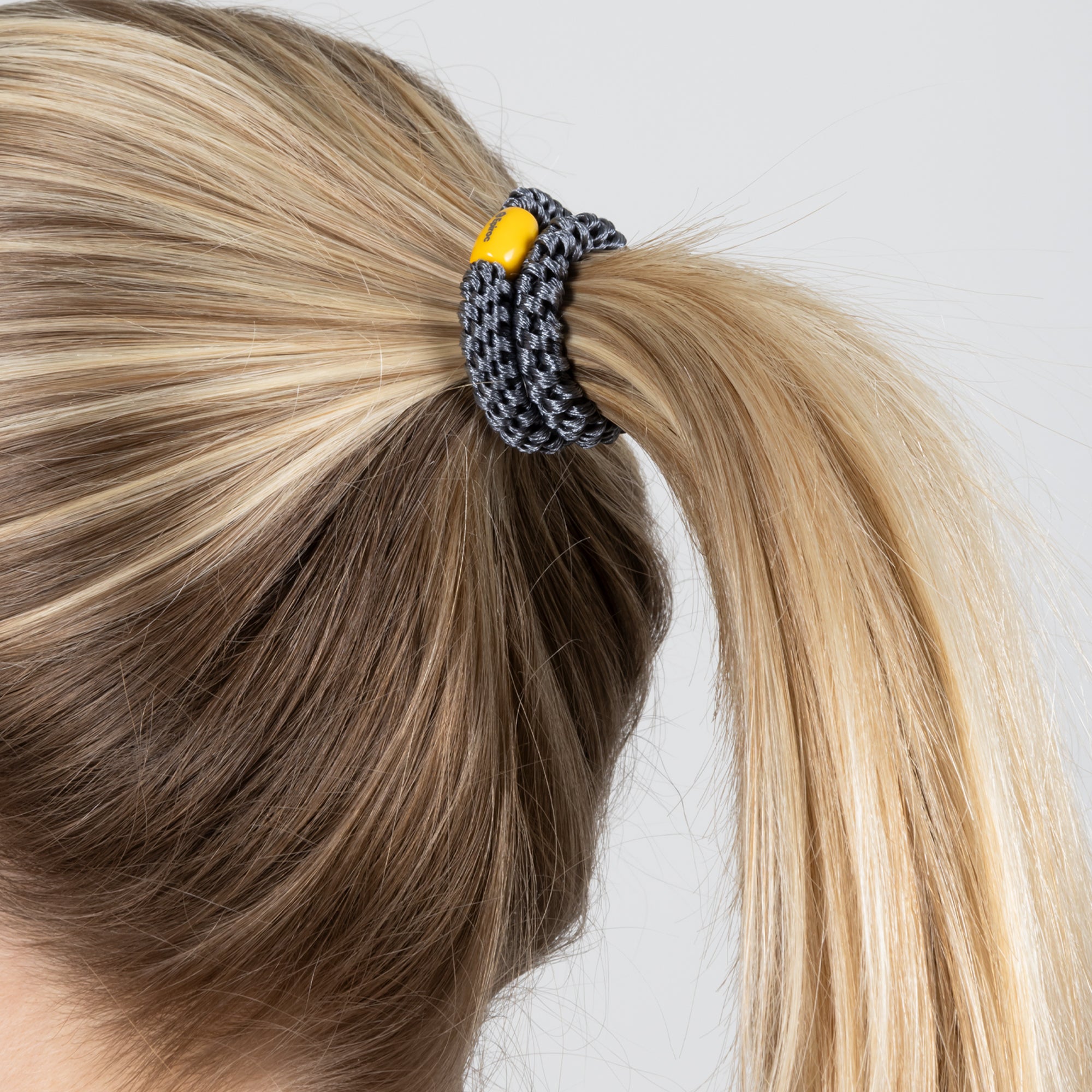 grey hair tie with epiroc logo