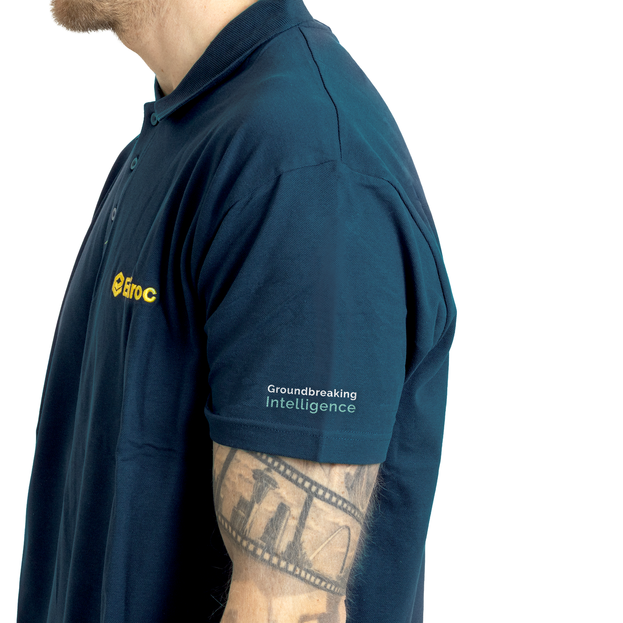 Grey polo with ground logo on left arm