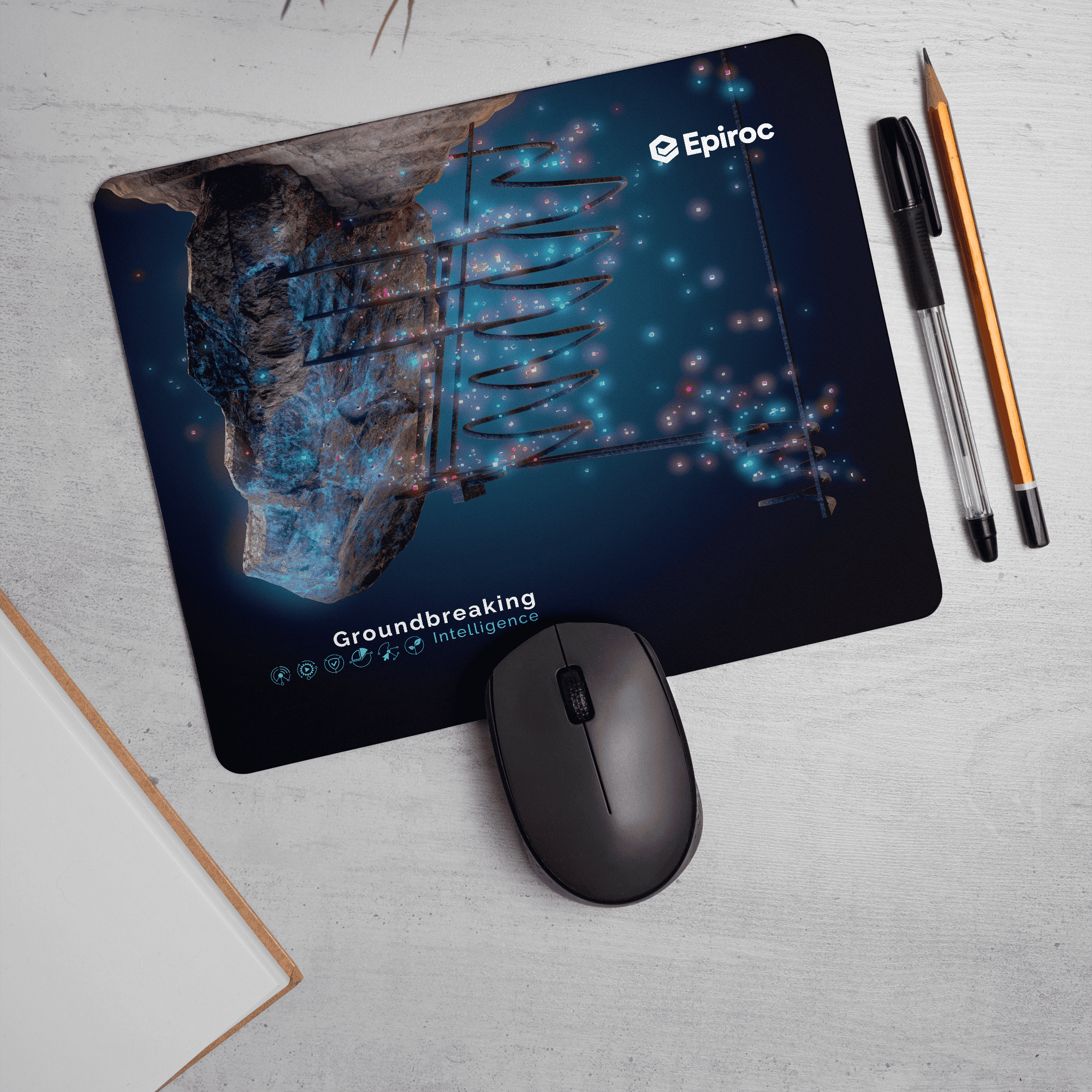 Epiroc mousepad with groundbreaking intelligence text and graphics