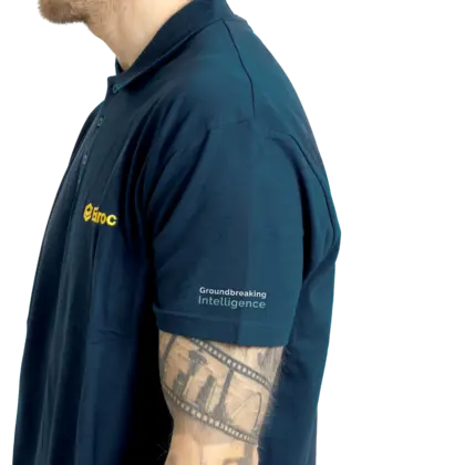 Grey polo with ground logo on left arm